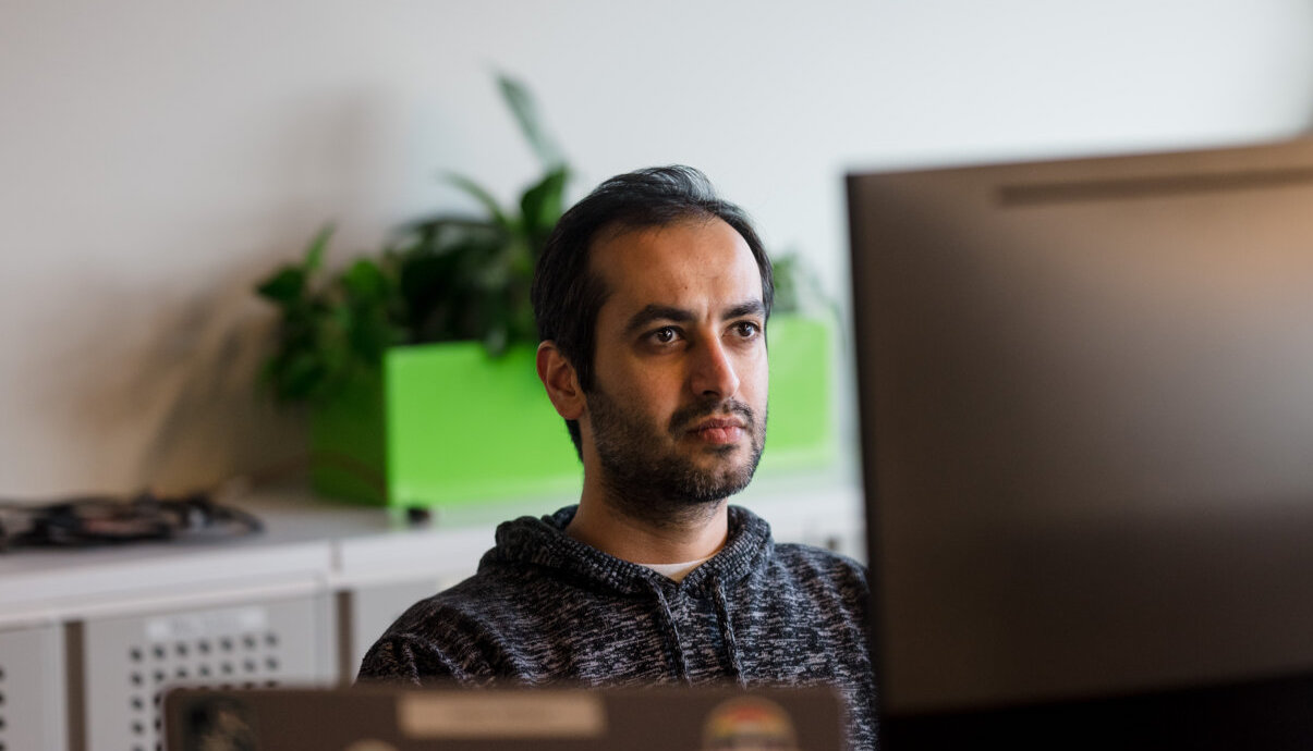 Man looking at computer monitor