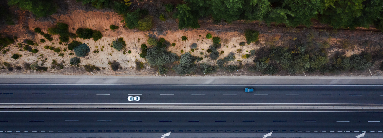 Cars driving on a highway overlaid with Latitude logo loops